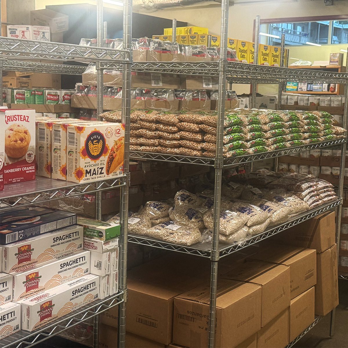 Photo of stocked shelves at the West Seattle Food Bank.