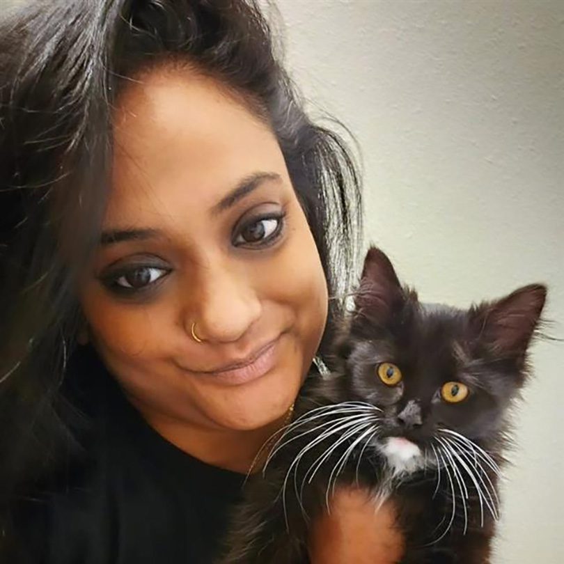 Anjali Riddick and kitten Smokey.