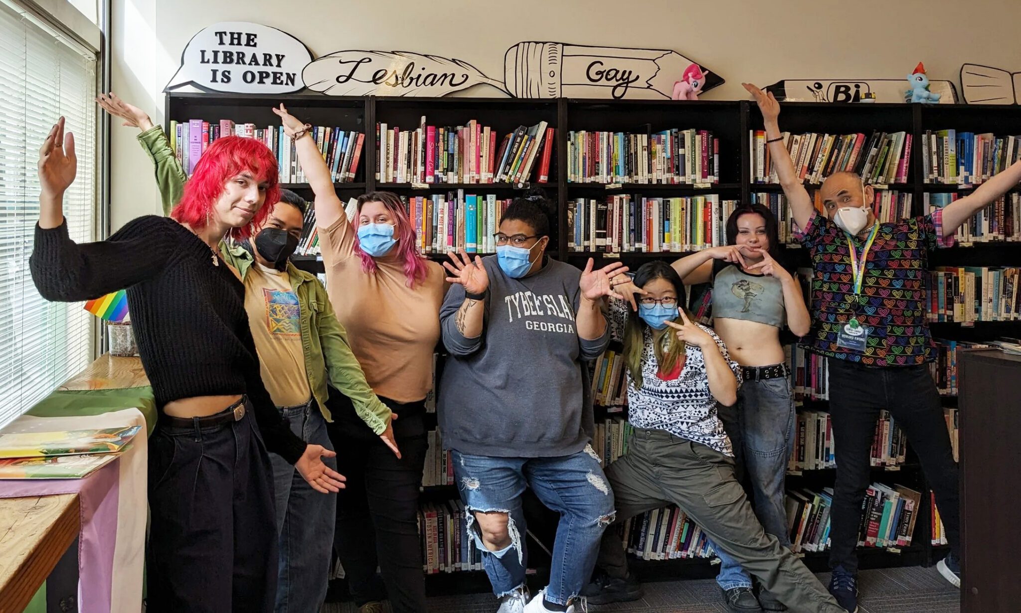 Staff and volunteers pose for a picture at the Seattle LGBTQ+ Center.